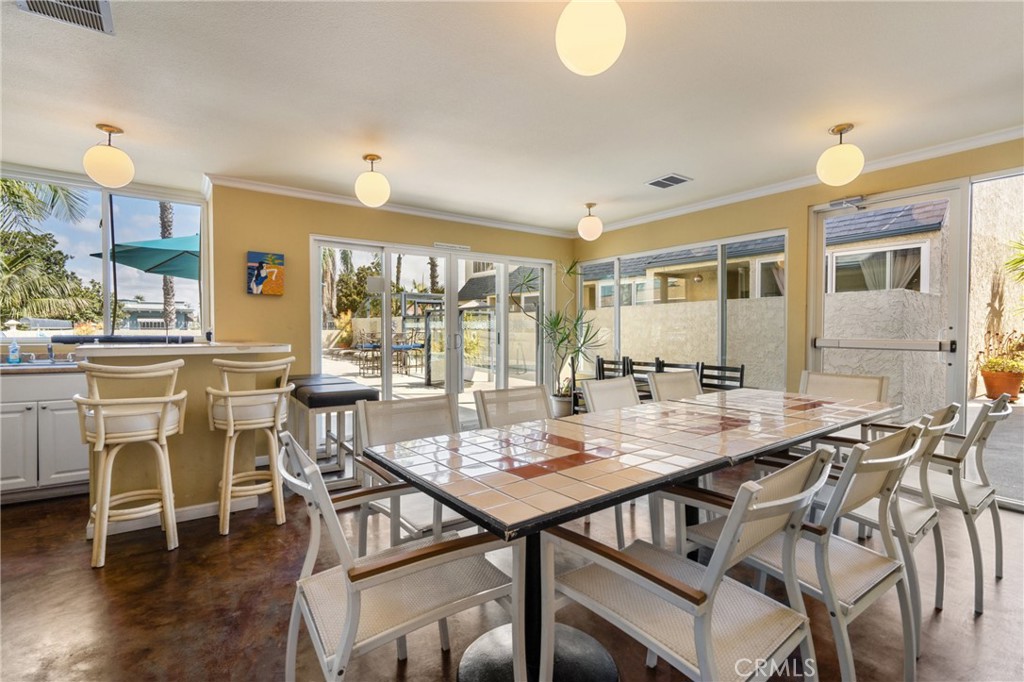 1 3rd Place, Unit 2 Long Beach, CA 90802 - Photo 24 of 55 a view of a dining room with furniture and wooden floor