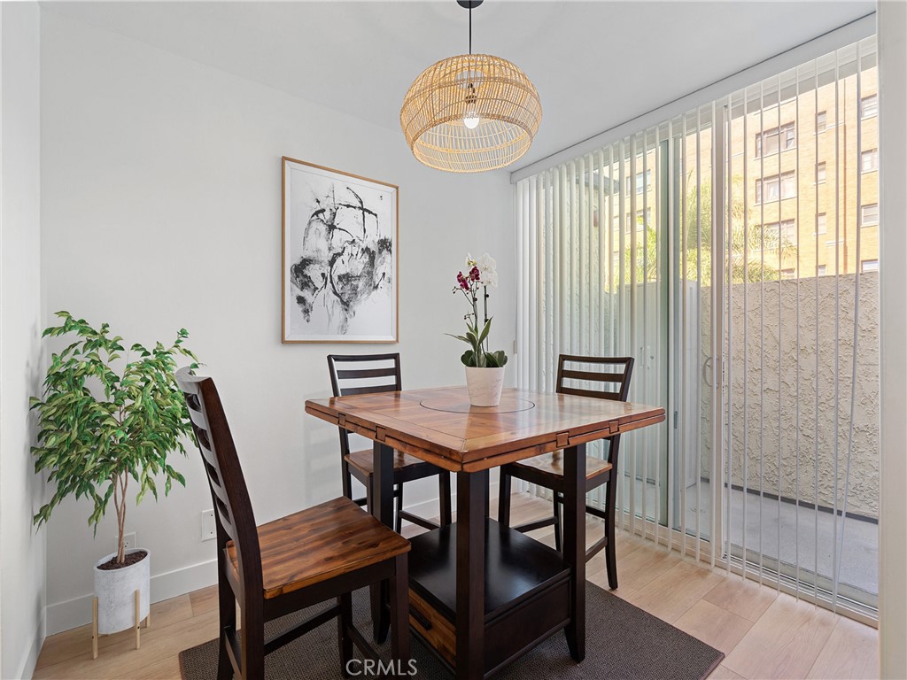 1 3rd Place, Unit 2 Long Beach, CA 90802 - Photo 9 of 55 a view of a dining room with furniture window and wooden floor