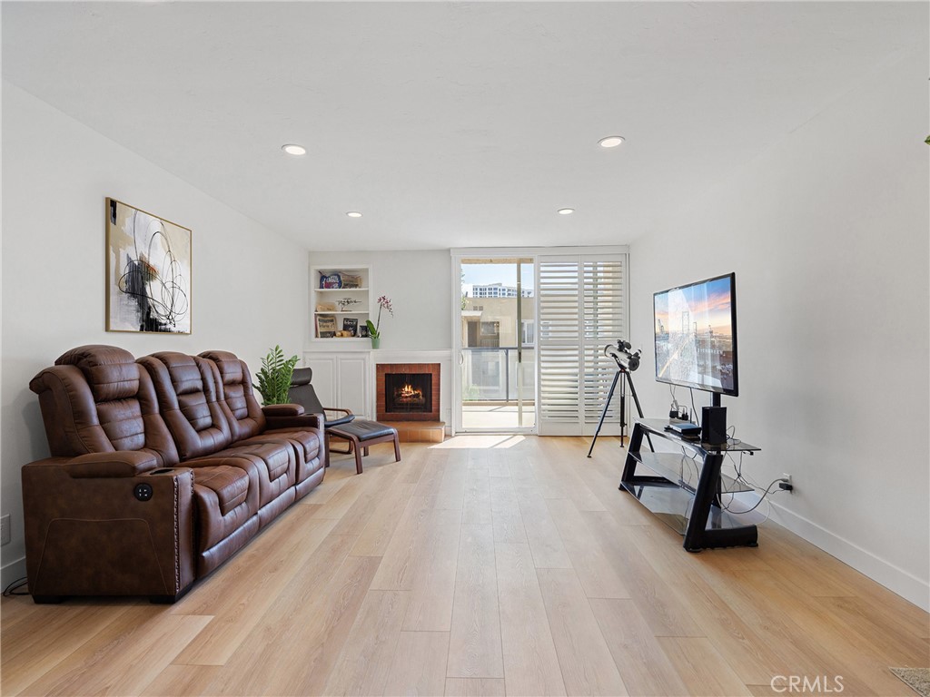 1 3rd Place, Unit 2 Long Beach, CA 90802 - Photo 10 of 55 a living room with furniture and a fireplace