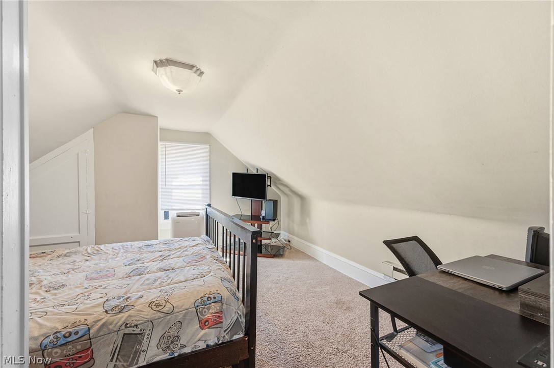 3386 Sylvanhurst Road Cleveland Heights, OH 44112 - Photo 32 of 46 Carpeted room with sloped ceilings, recessed window, and white window blinds