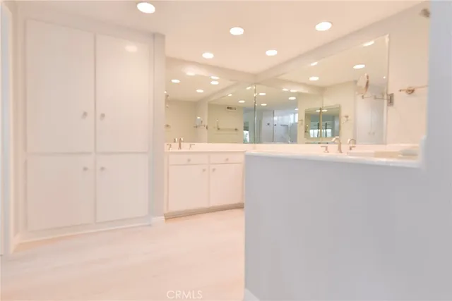 a view of a kitchen and an empty room