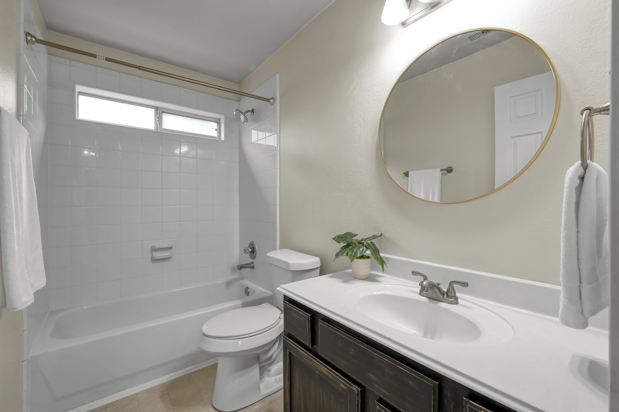 631 Timberstand Lane Spring, TX 77373 - Photo 28 of 38 The secondary bathroom features a clean, neutral design with a tub/shower combination and updated mirror detail.