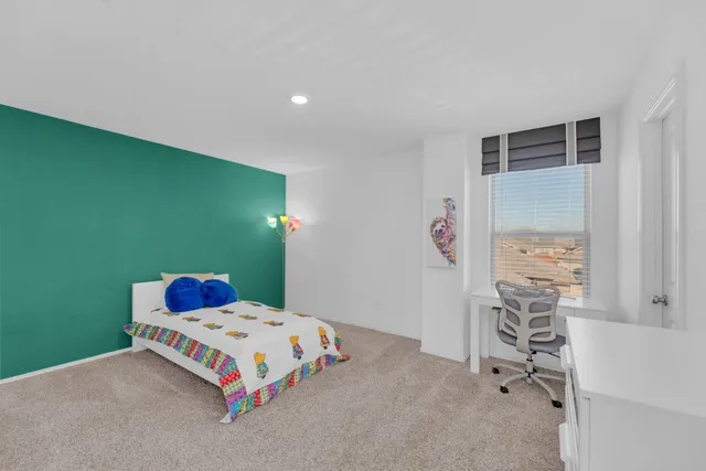 a bedroom with a bed and a cabinets