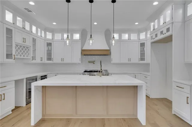 a kitchen with a sink and cabinets