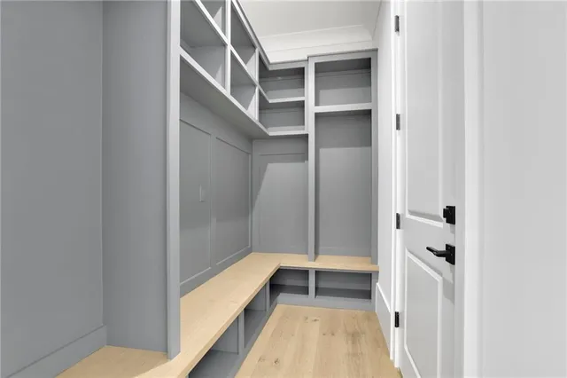 a view of an empty room with a staircase