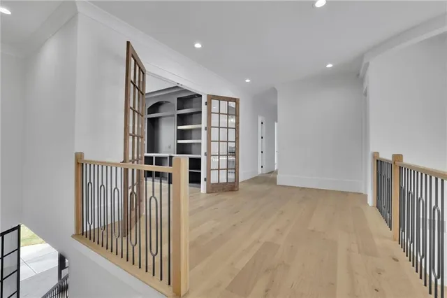 an empty room with windows and entrance