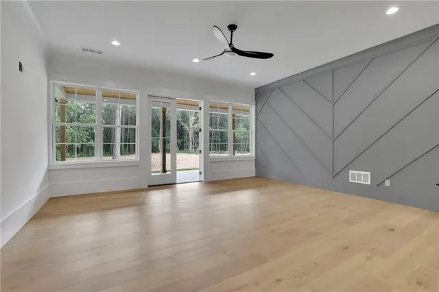 a view of house with a yard and deck