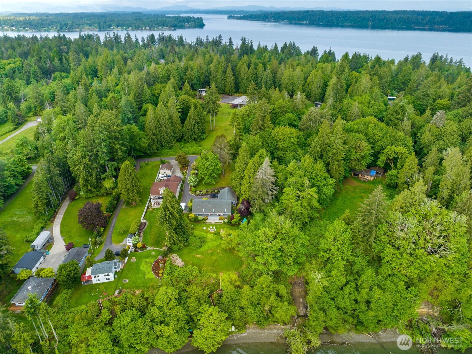 9728 Cascade Loop Northeast Olympia, WA 98516 - Photo 12 of 13 a view of a garden with a building