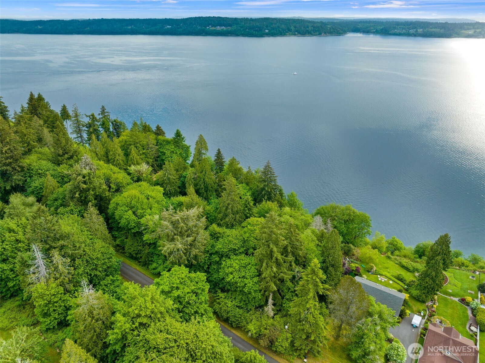 9728 Cascade Loop Northeast Olympia, WA 98516 - Photo 6 of 13 a view of a lake with a outdoor space
