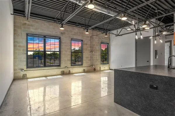 a view of a living room with a large window