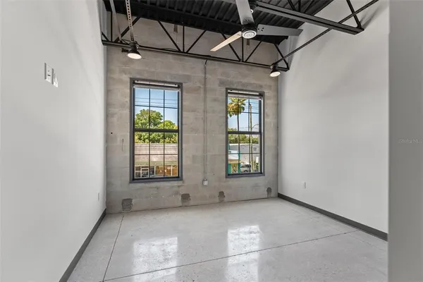 a view of an empty room with a window