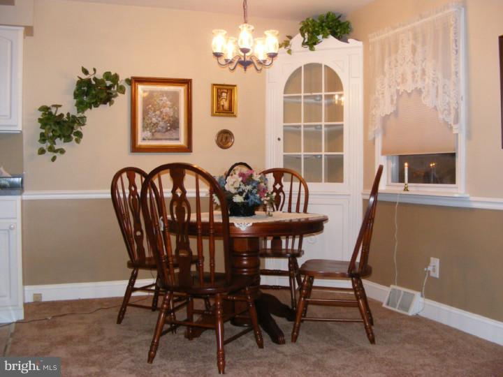 18 Warwick Road Stratford, NJ 08084 - Photo 4 of 25 a view of a dining room with furniture and chandelier