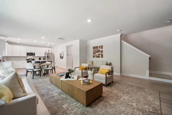 a living room with furniture and a table