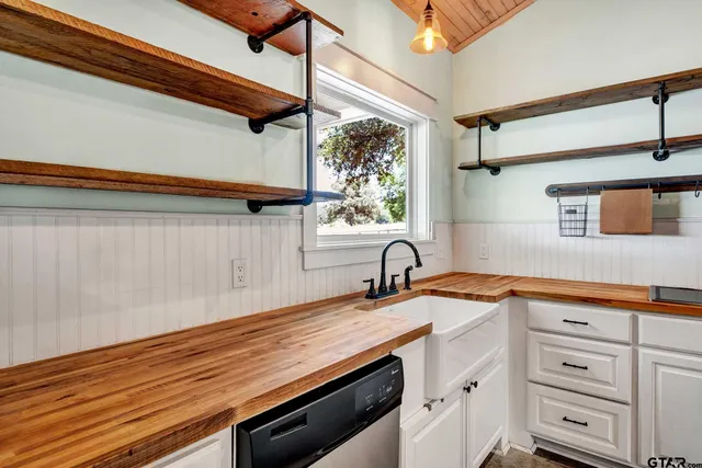 a kitchen with a sink and cabinets