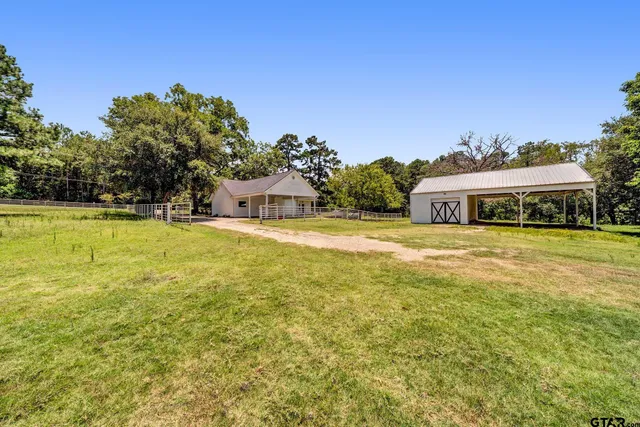 a view of a house with a big yard