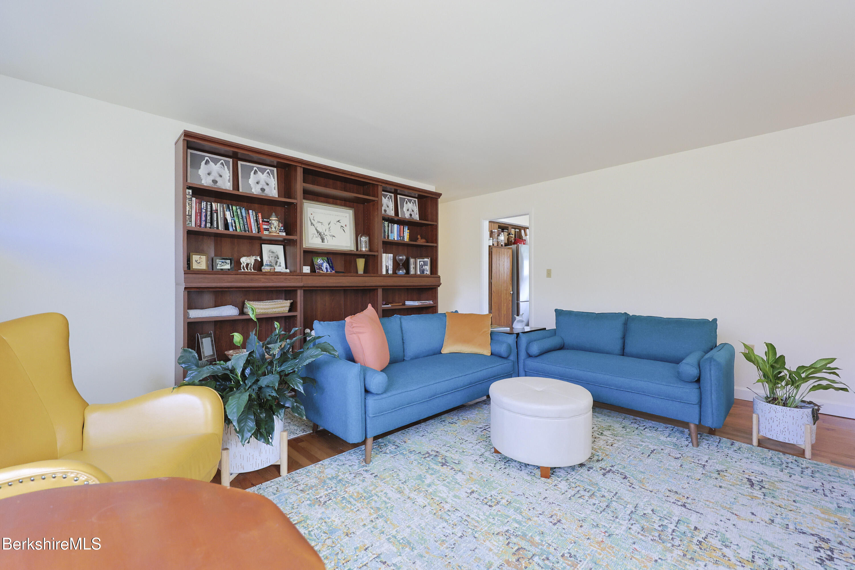 16 East New Lenox Road Lenox, MA 01240 - Photo 25 of 31 a living room with furniture and a book shelf