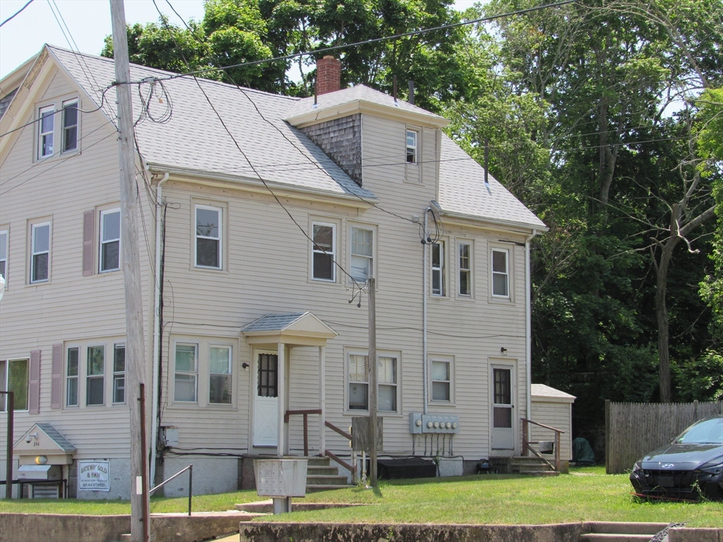 290 Main Street Wareham, MA 02571 - Photo 1 of 11 a aerial view of a house next to a big yard and large trees