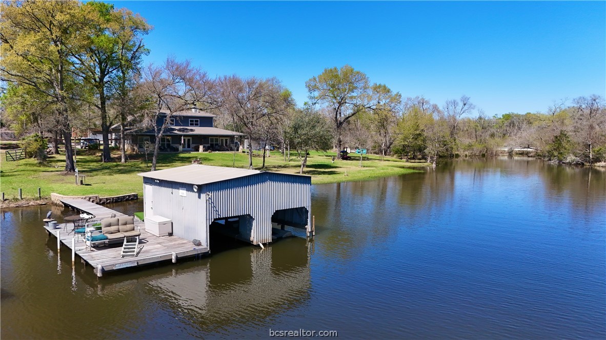 11810 Riley Green Road Franklin, TX 77856 - Photo 3 of 36 a swimming pool with outdoor seating and yard