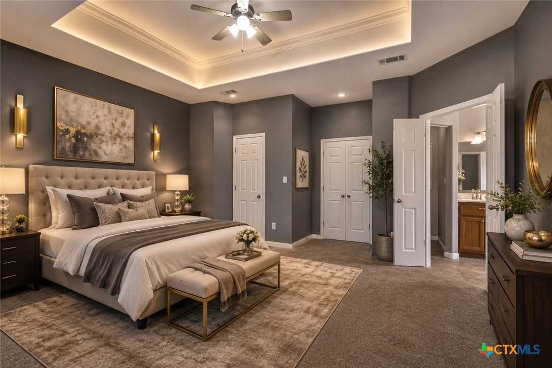 283 County Road 4710 Kempner, TX 76539 - Photo 22 of 47 a bedroom with a large bed and a chandelier