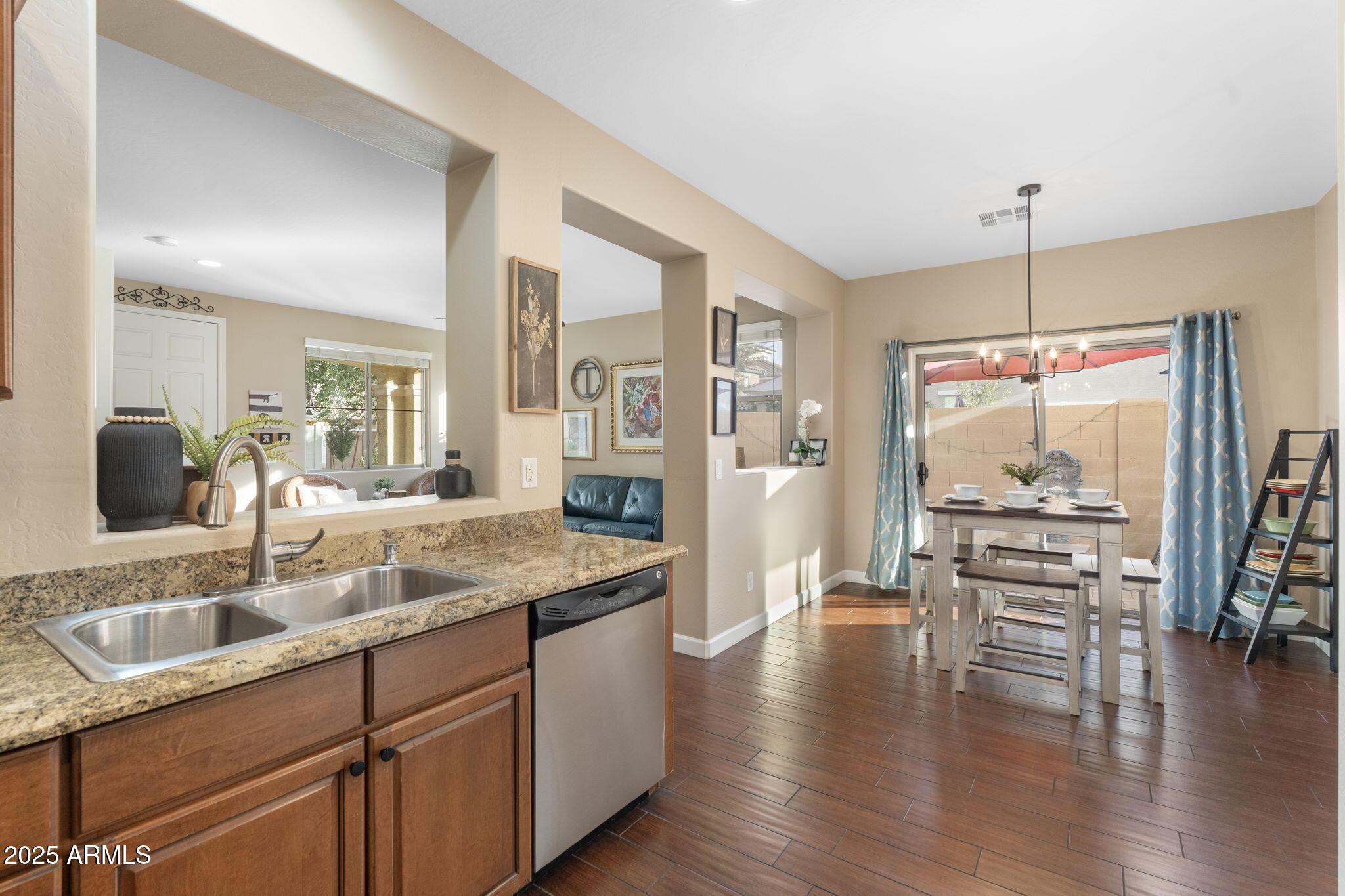 1705 East Joseph Way Gilbert, AZ 85295 - Photo 13 of 39 a kitchen with a table chairs refrigerator and window