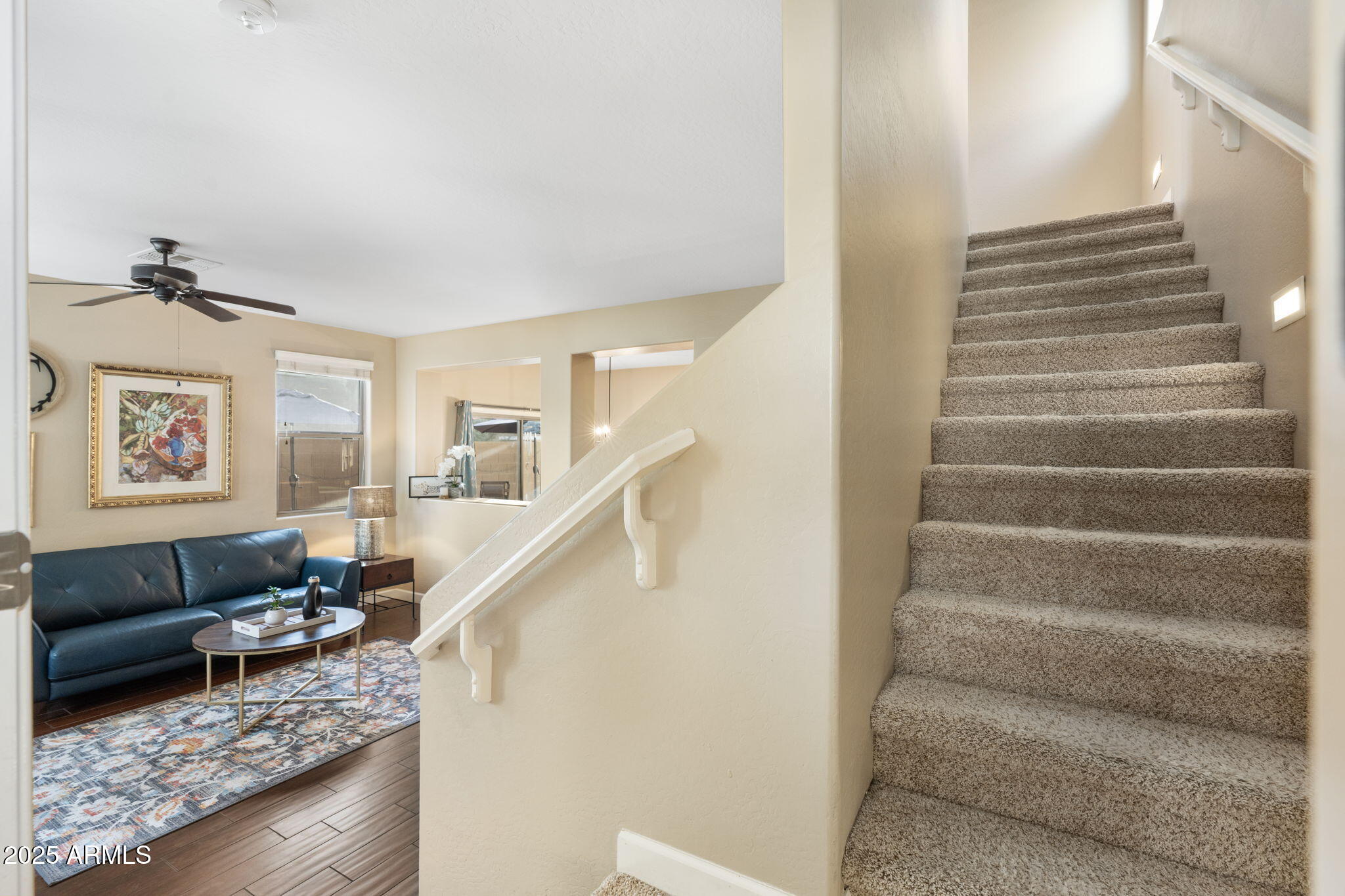 1705 East Joseph Way Gilbert, AZ 85295 - Photo 15 of 39 a living room with furniture and stairs