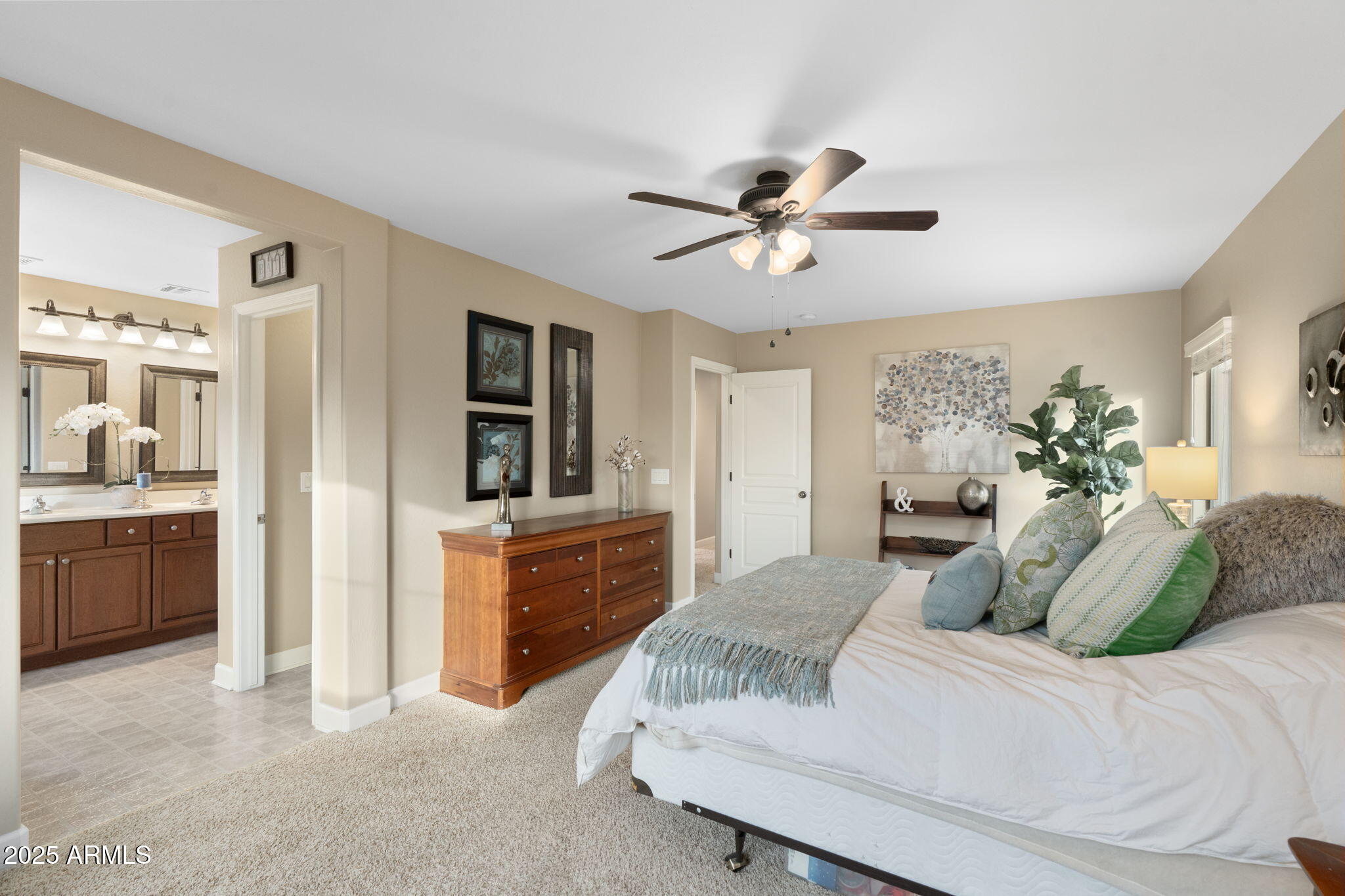 1705 East Joseph Way Gilbert, AZ 85295 - Photo 17 of 39 a bedroom with a large bed and a chandelier