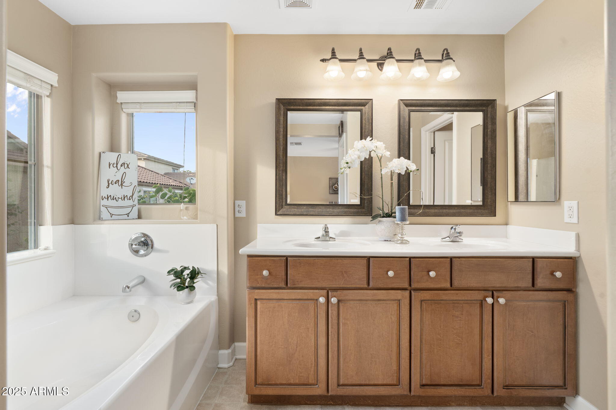 1705 East Joseph Way Gilbert, AZ 85295 - Photo 18 of 39 a bathroom with a granite countertop sink and a large mirror