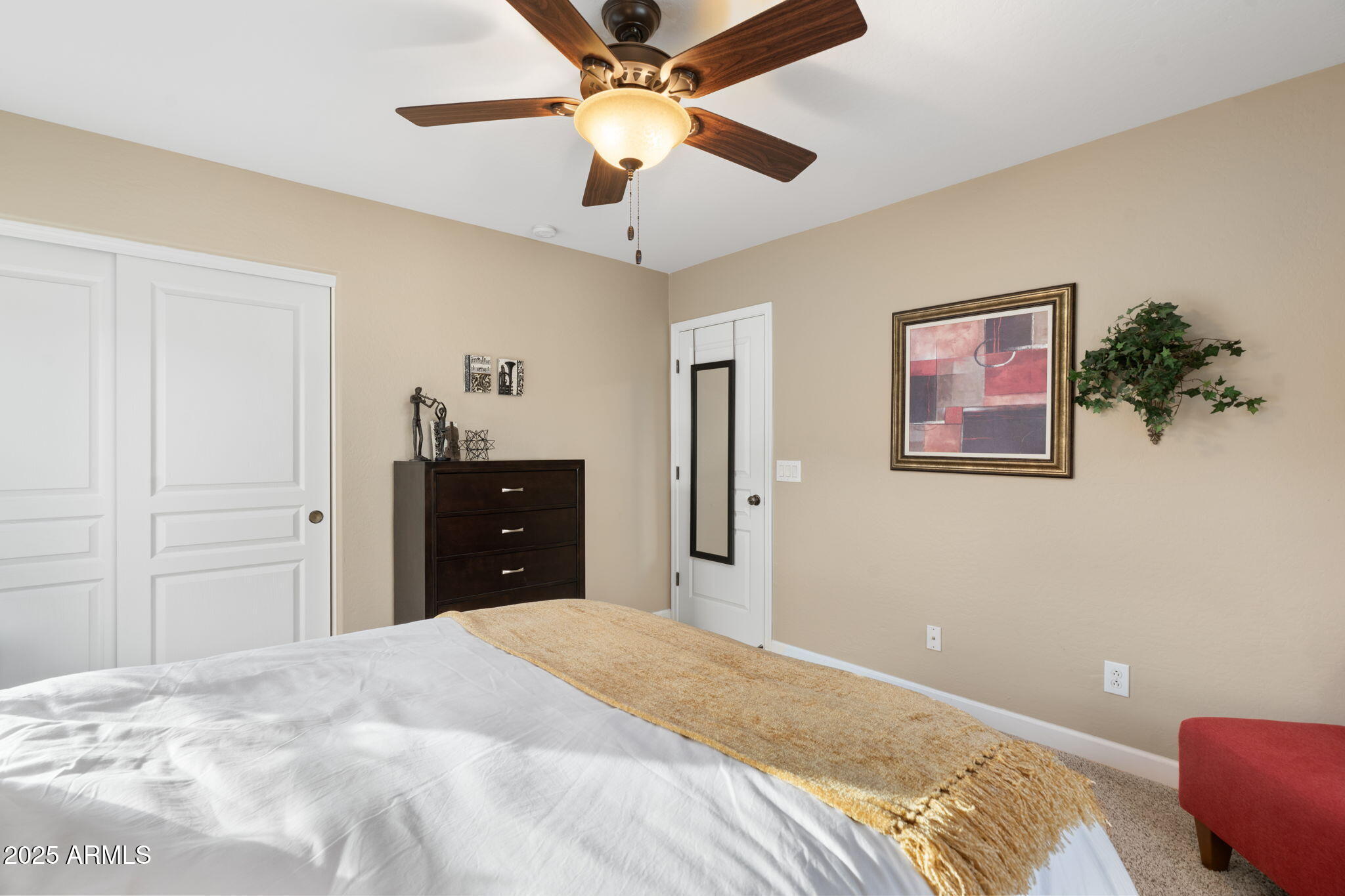 1705 East Joseph Way Gilbert, AZ 85295 - Photo 22 of 39 a bedroom with a bed and a chandelier