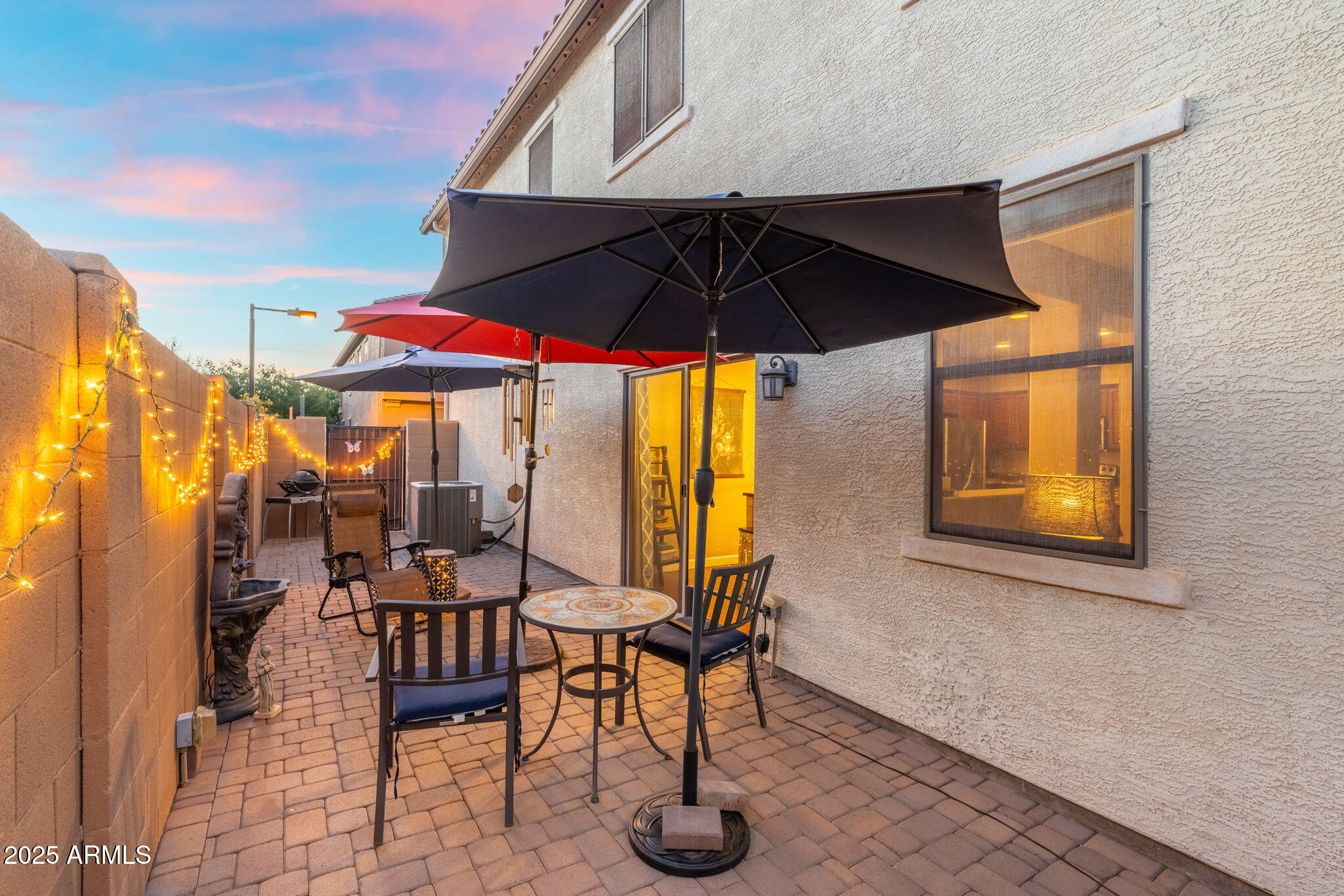 1705 East Joseph Way Gilbert, AZ 85295 - Photo 27 of 39 a view of patio with chairs and table under an umbrella