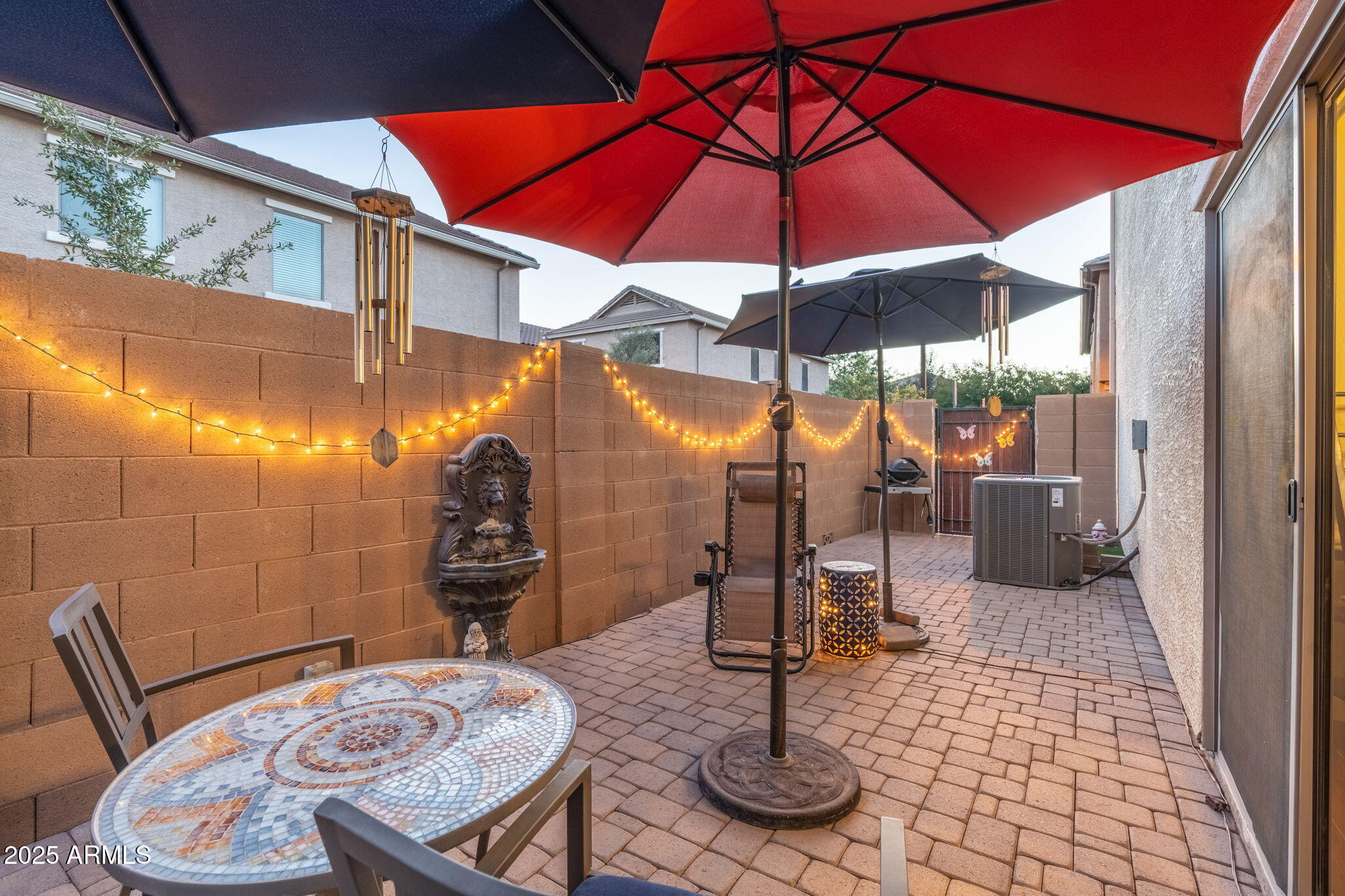 1705 East Joseph Way Gilbert, AZ 85295 - Photo 29 of 39 a view of a patio with a table and chairs under an umbrella