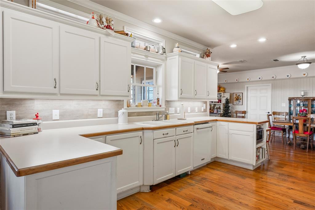 14410 Fm 455 Street West Decatur, TX 76234 - Photo 11 of 40 a kitchen with a sink cabinets and window