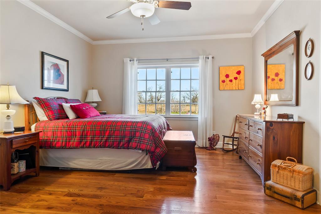 14410 Fm 455 Street West Decatur, TX 76234 - Photo 16 of 40 a bedroom with a bed and wooden floor
