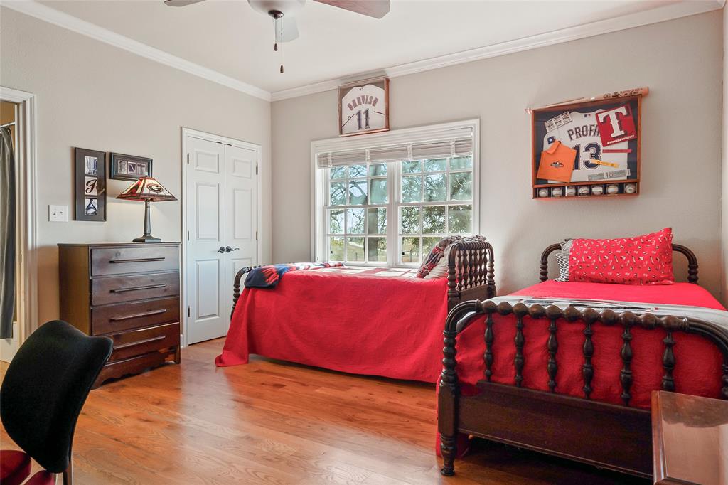 14410 Fm 455 Street West Decatur, TX 76234 - Photo 19 of 40 a bedroom with two beds and a dresser