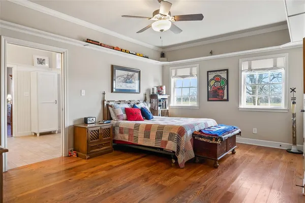 a bedroom with bed and a window