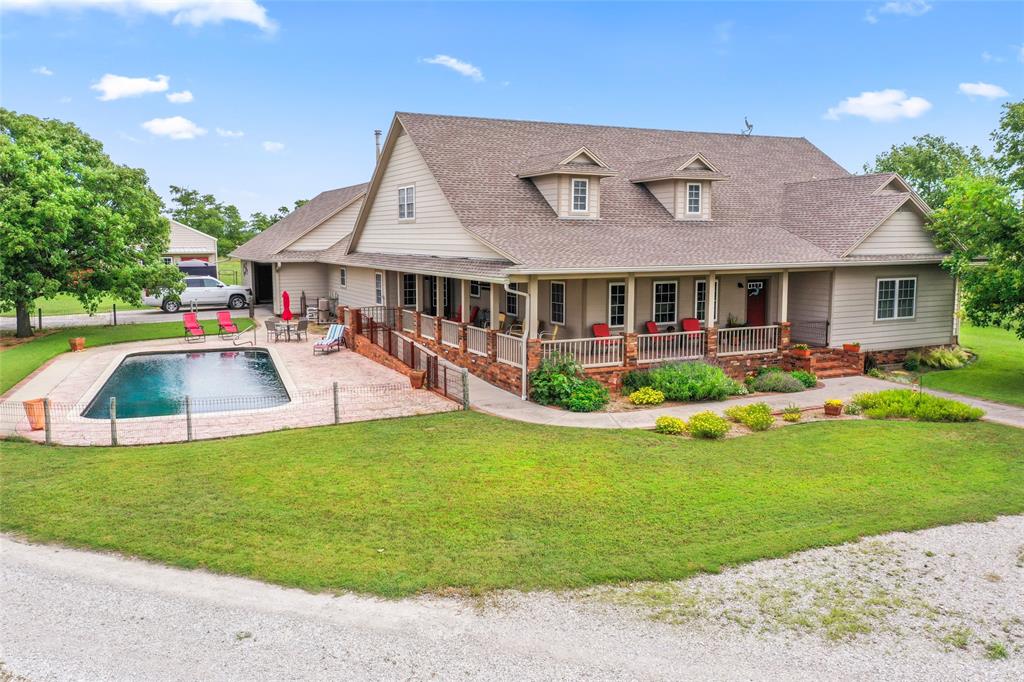 14410 Fm 455 Street West Decatur, TX 76234 - Photo 2 of 40 a front view of house with yard and outdoor seating