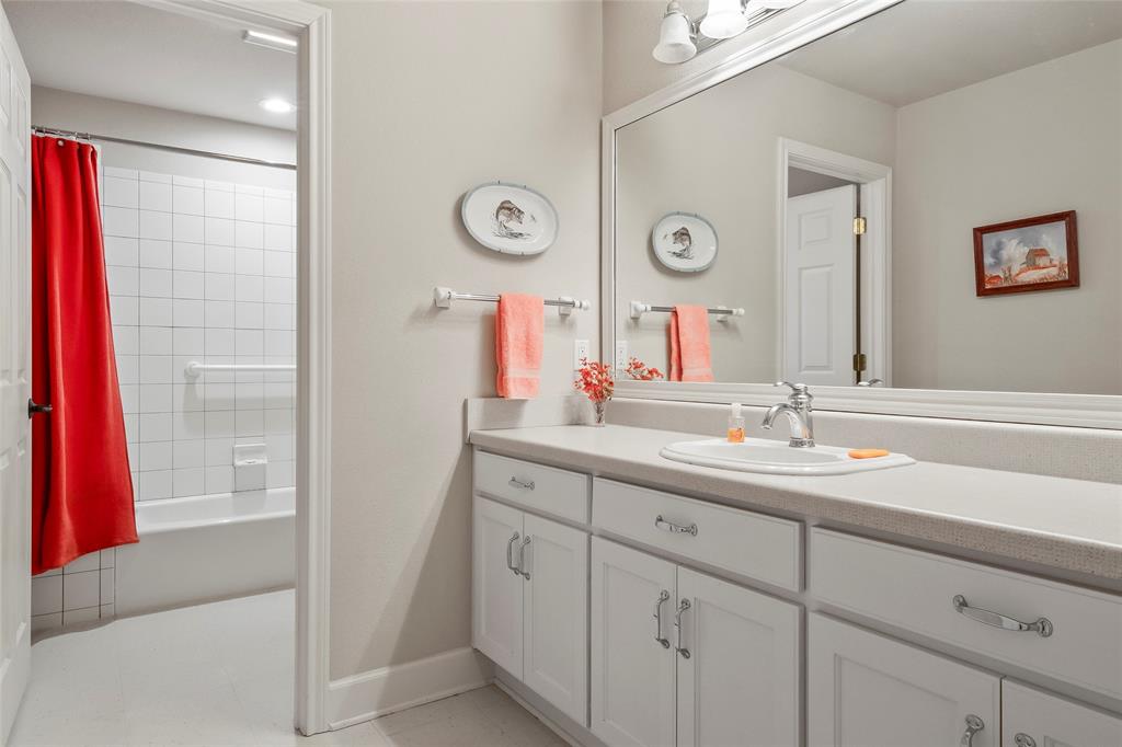 14410 Fm 455 Street West Decatur, TX 76234 - Photo 27 of 40 a bathroom with a double vanity sink and a mirror