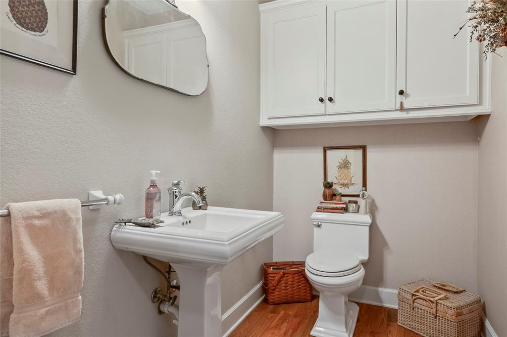 14410 Fm 455 Street West Decatur, TX 76234 - Photo 29 of 40 a bathroom with a toilet a sink and mirror