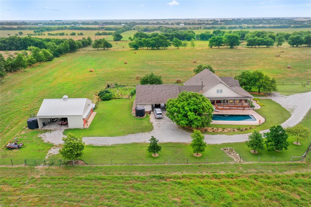 14410 Fm 455 Street West Decatur, TX 76234 - Photo 31 of 40 an aerial view of a house with outdoor space swimming pool and mountains