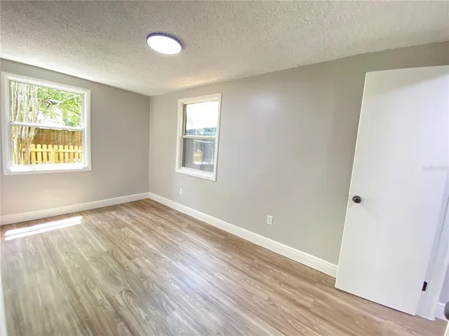 a room with a wooden floor and a table
