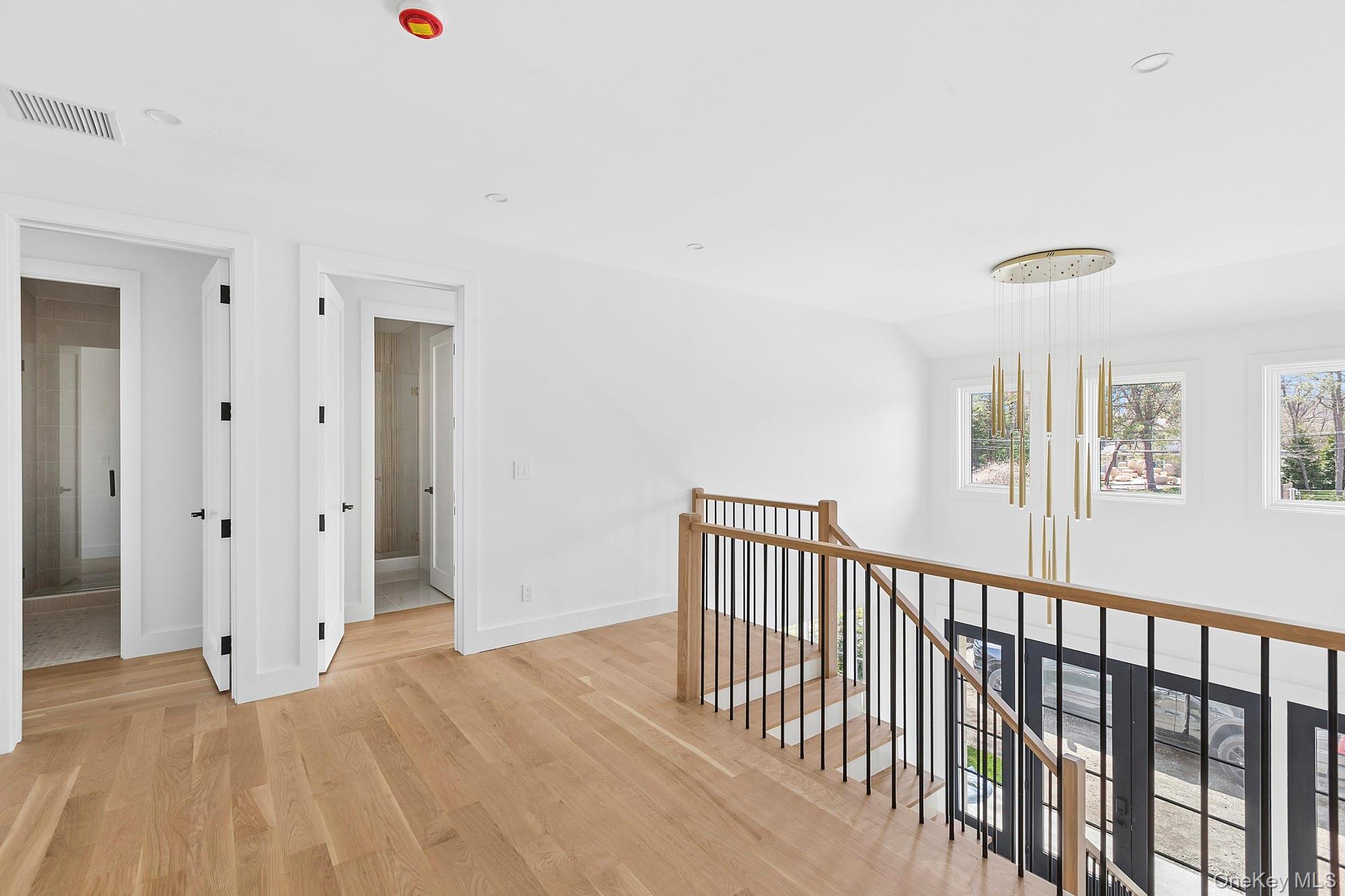 14 Ridge Road Southampton, NY 11968 - Photo 11 of 23 a view of a livingroom with wooden floor and windows