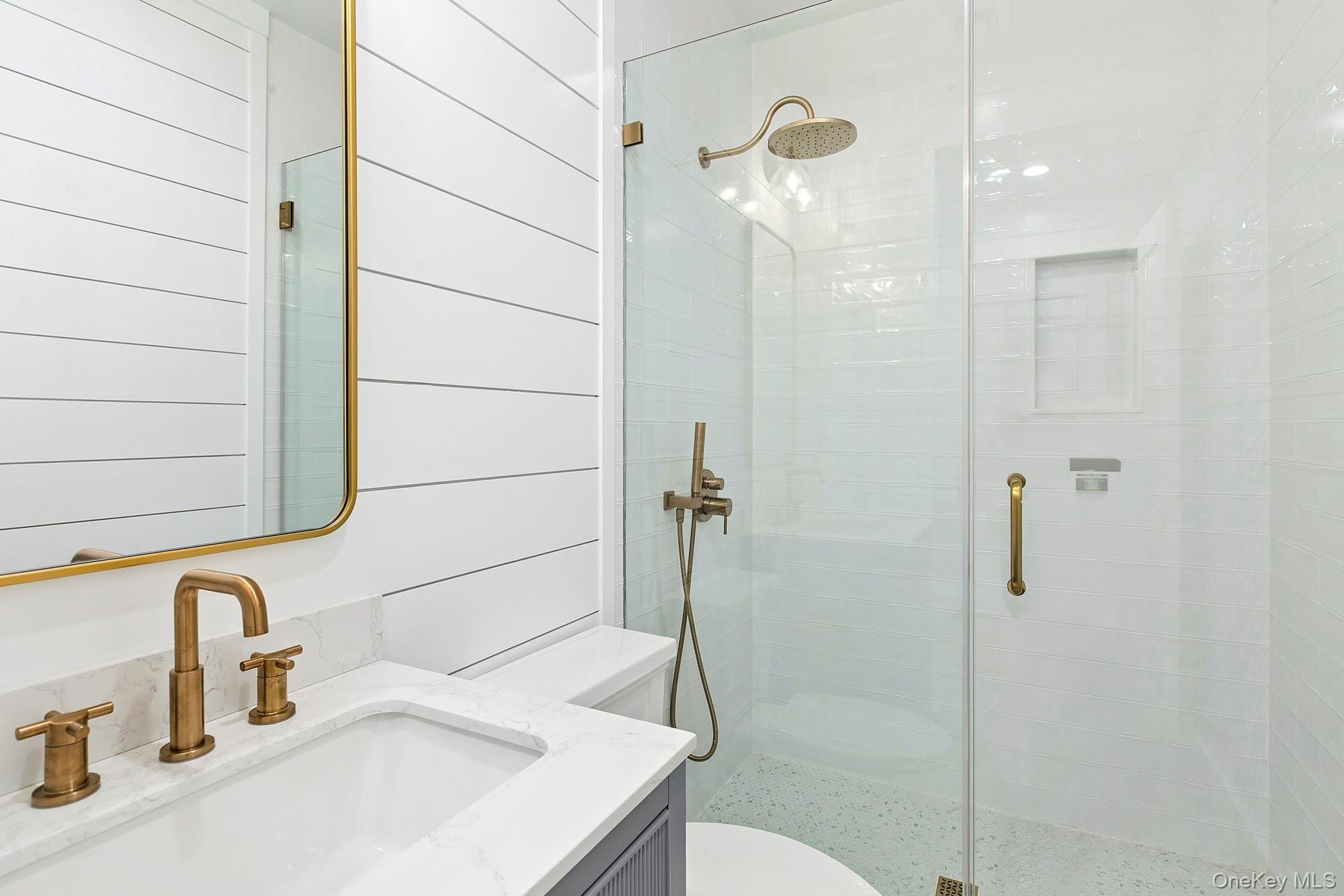 14 Ridge Road Southampton, NY 11968 - Photo 15 of 23 a bathroom with a sink and a shower