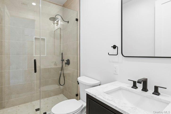 14 Ridge Road Southampton, NY 11968 - Photo 18 of 23 a bathroom with a granite countertop sink toilet and shower
