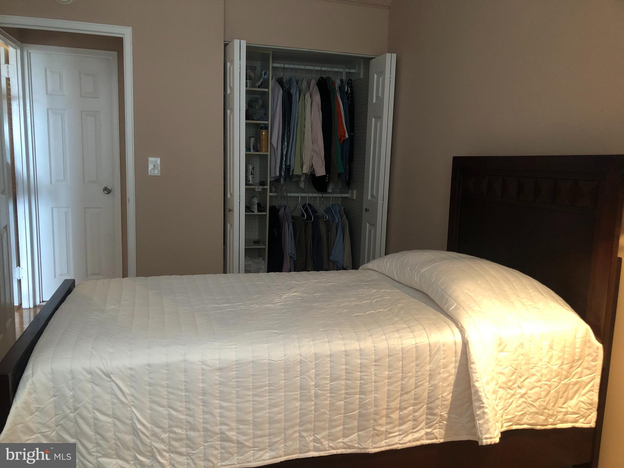 1600 Hagys Ford Road, Unit 7R Narberth, PA 19072 - Photo 12 of 20 a bedroom with a bed and wooden floor