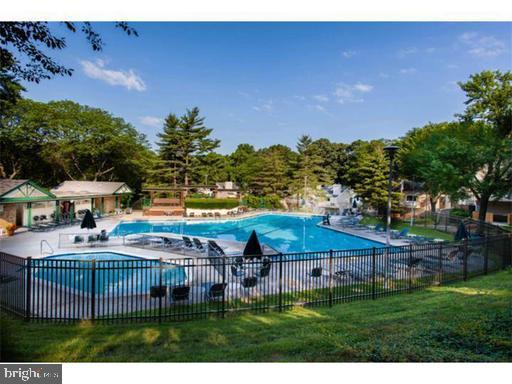 1600 Hagys Ford Road, Unit 7R Narberth, PA 19072 - Photo 20 of 20 a front view of house with yard and trees