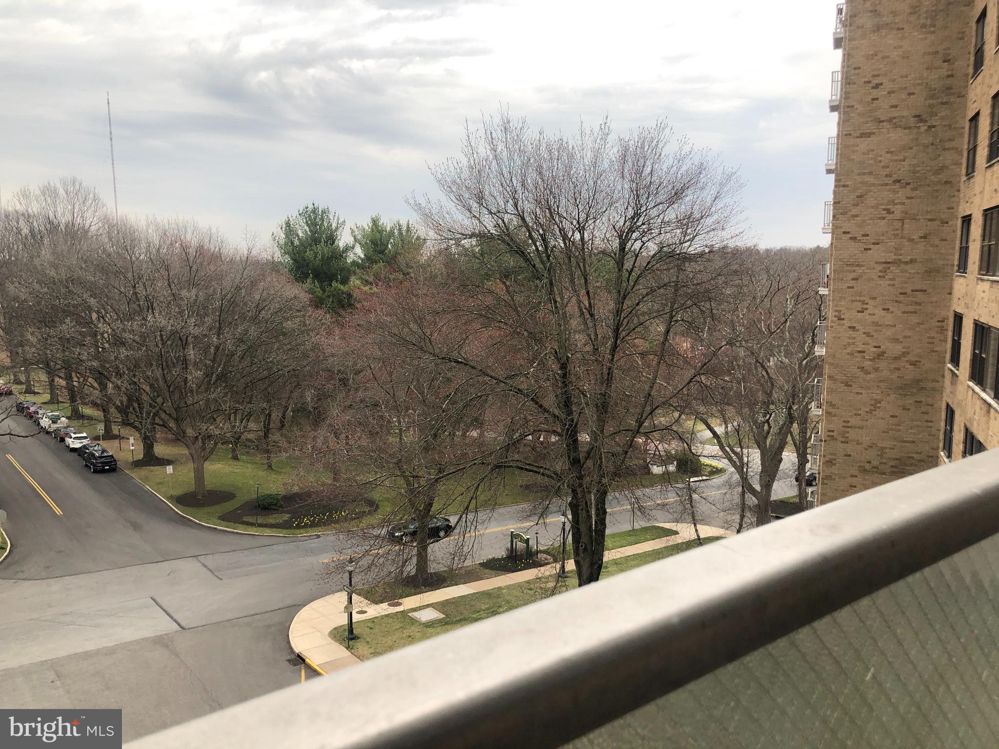 1600 Hagys Ford Road, Unit 7R Narberth, PA 19072 - Photo 7 of 20 a view of a cars park on the side of a road