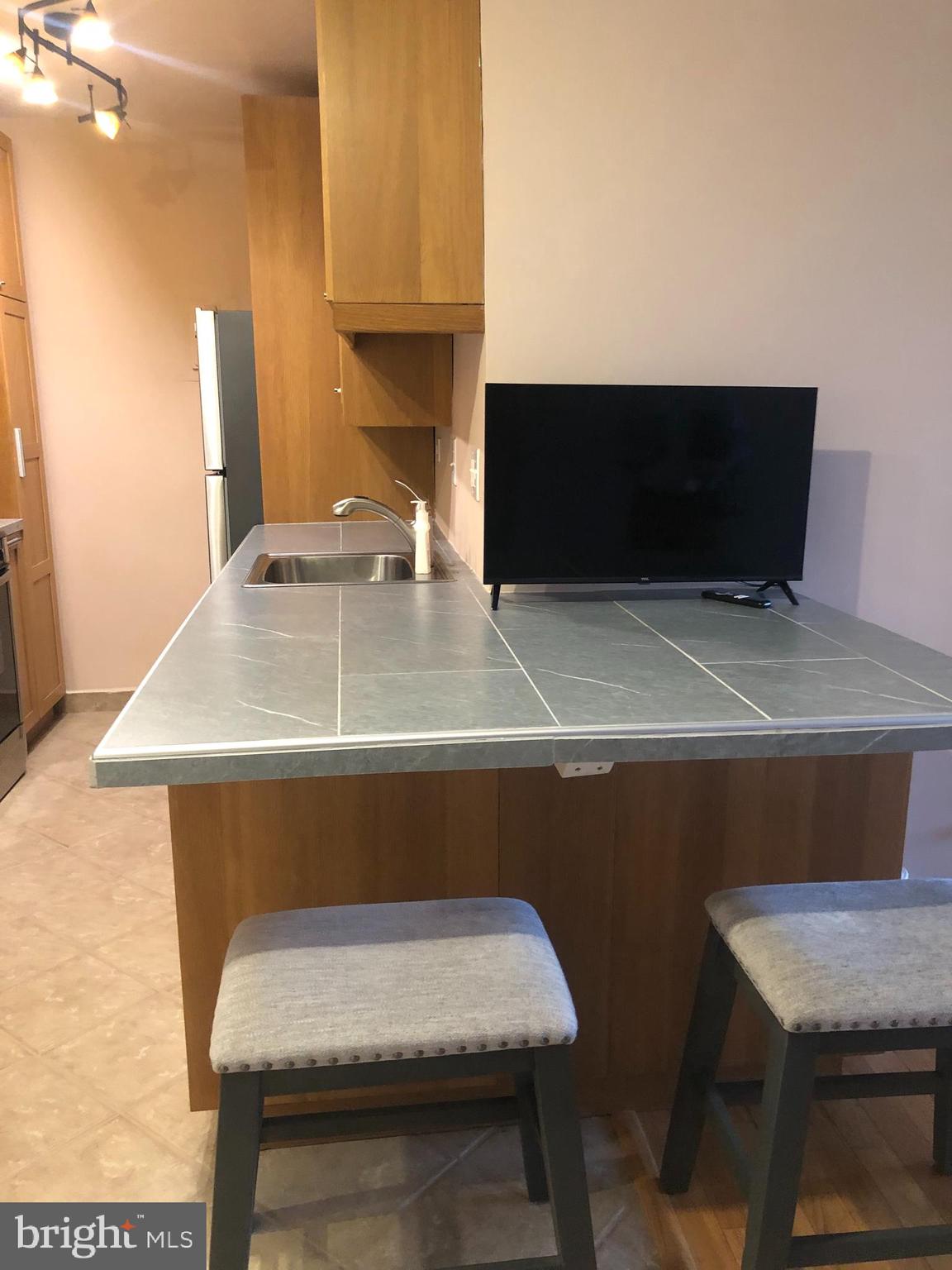 1600 Hagys Ford Road, Unit 7R Narberth, PA 19072 - Photo 9 of 20 a room with a table and chairs