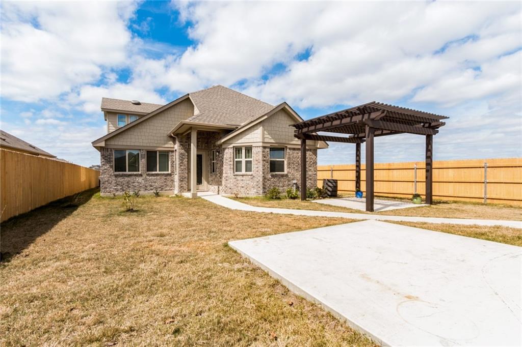 2104 Pindos Pony Way Georgetown, TX 78626 - Photo 25 of 30 A striking contemporary home with a decorative pergola offers exceptional outdoor living space.