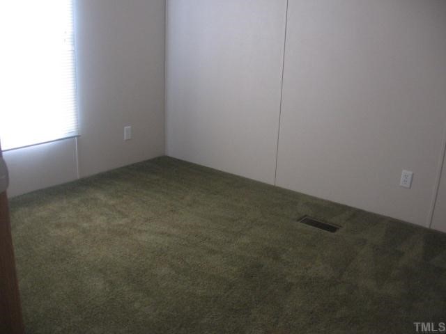 7621 Cassam Road Bahama, NC 27503 - Photo 8 of 8 an empty room with a empty space