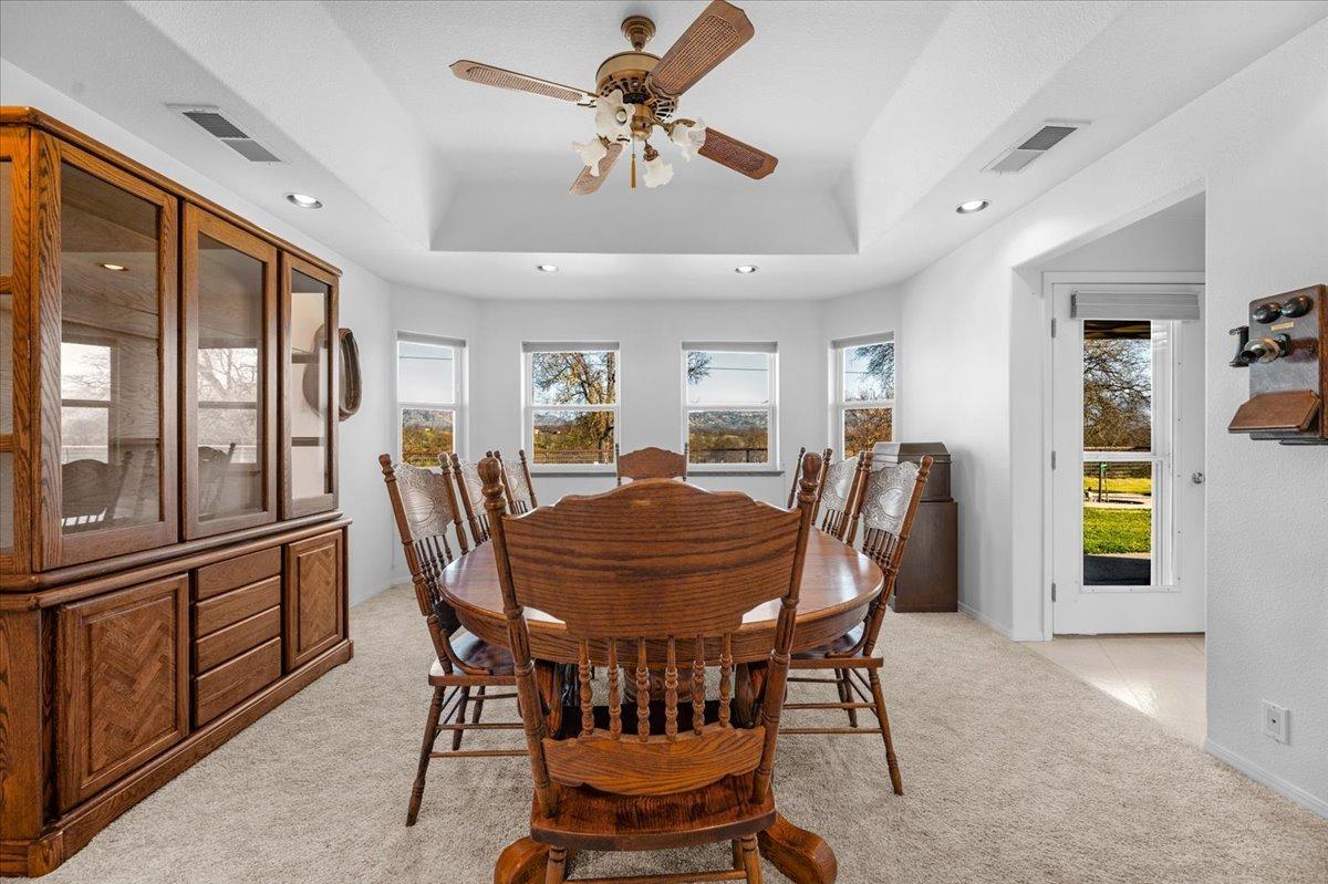 10925 Rusty Spur Lane Clovis, CA 93619 - Photo 23 of 94 a view of a dining room with furniture window and wooden floor