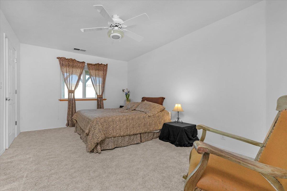 10925 Rusty Spur Lane Clovis, CA 93619 - Photo 28 of 94 a bedroom with a bed and a window